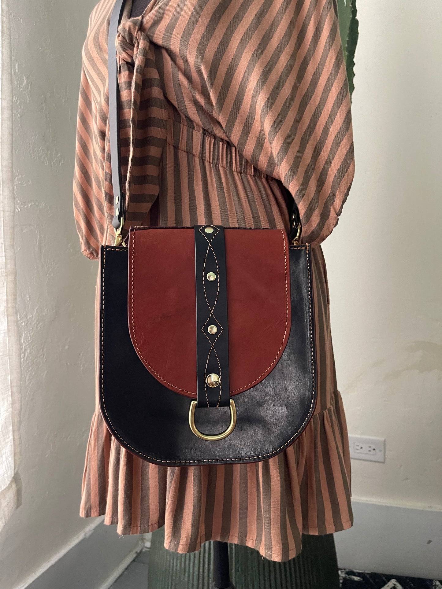 Echo with Black Strap and Brass D rings